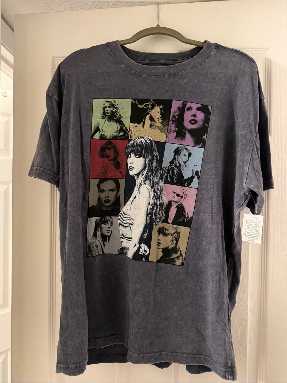 Taylor Swift Eras Tour T-shirt on gray charcoal